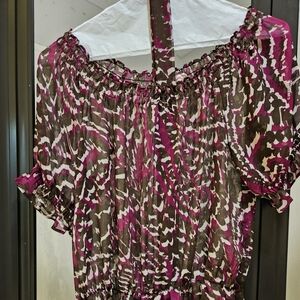 A brown and burgundy sheer blouse.